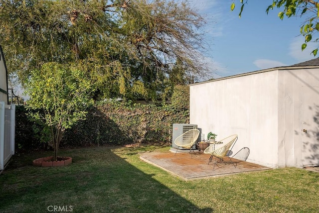 view of yard featuring a patio, ac unit, and a fenced backyard