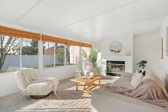 sunroom featuring a fireplace