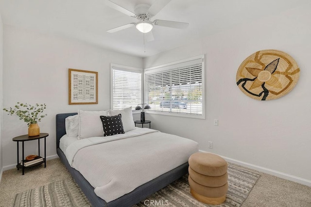 bedroom with carpet floors, ceiling fan, and baseboards