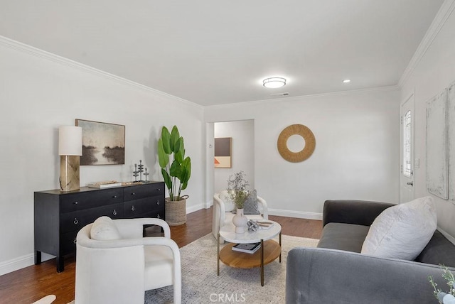 living room with dark wood-style floors, ornamental molding, and baseboards