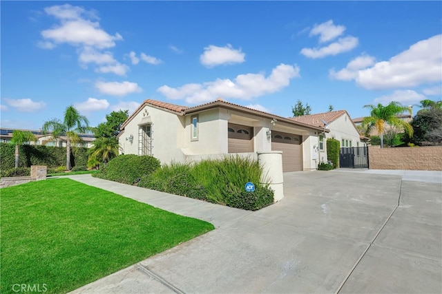 mediterranean / spanish home featuring stucco siding, fence, a garage, driveway, and a tiled roof