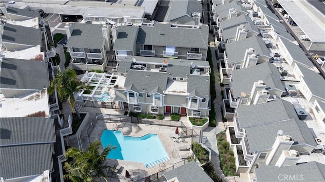 birds eye view of property with a residential view