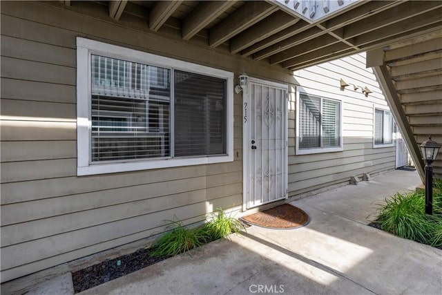 entrance to property featuring a patio