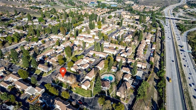 birds eye view of property with a residential view