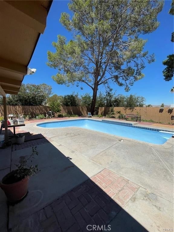 view of swimming pool with a fenced in pool, a patio area, and a fenced backyard