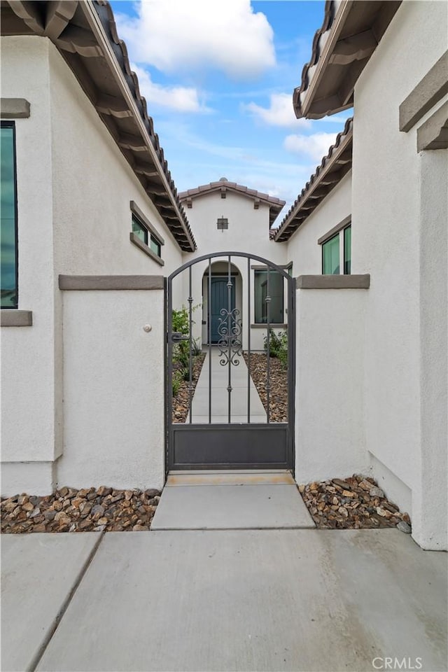 view of gate featuring a fenced front yard