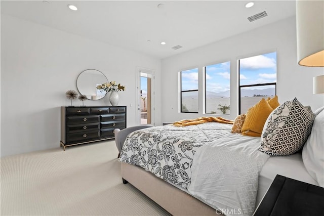 bedroom featuring carpet floors, visible vents, a mountain view, and recessed lighting