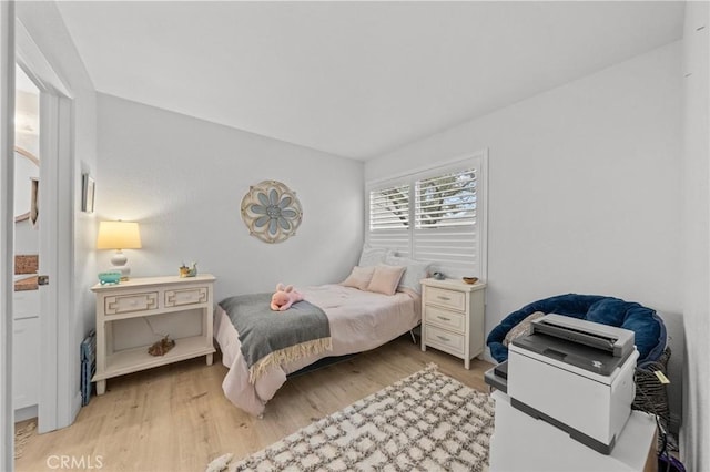 bedroom with light wood-type flooring