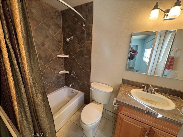 bathroom featuring toilet, shower / bath combo with shower curtain, vanity, and tile patterned floors