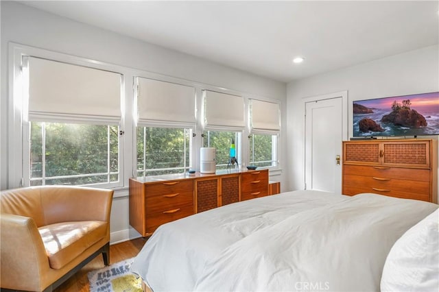 bedroom featuring light wood-style floors and recessed lighting