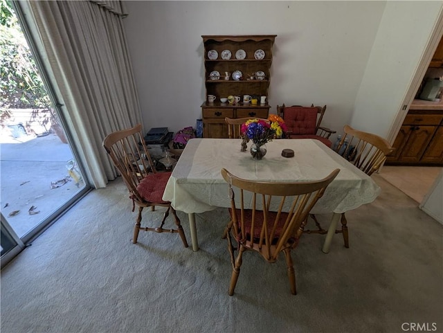 dining area with light carpet