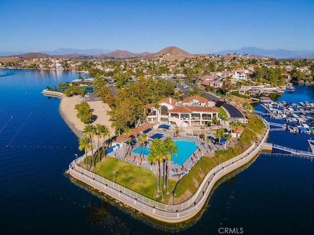 drone / aerial view with a water and mountain view