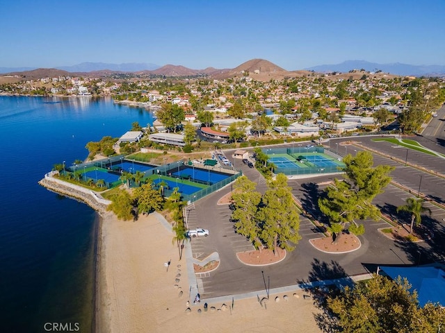 birds eye view of property featuring a water and mountain view