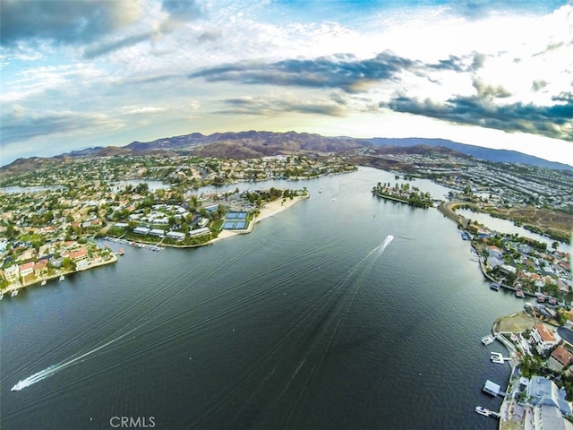 birds eye view of property featuring a water and mountain view