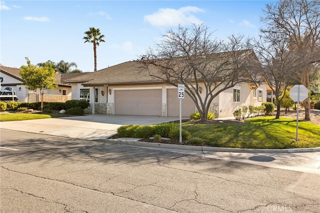 view of front of property with a garage, a front yard, driveway, and stucco siding