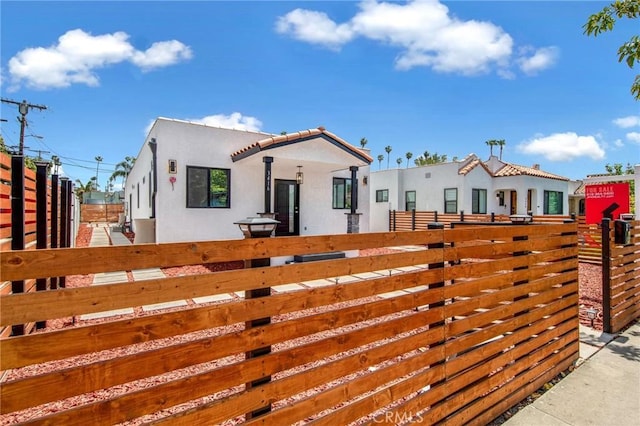 view of gate featuring a fenced front yard