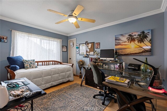 bedroom with ornamental molding and wood finished floors