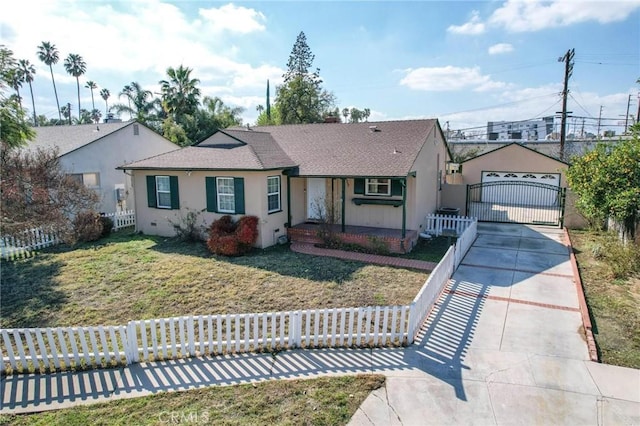 single story home with a garage, a front lawn, a fenced front yard, and stucco siding