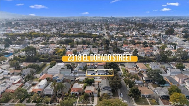 birds eye view of property with a residential view