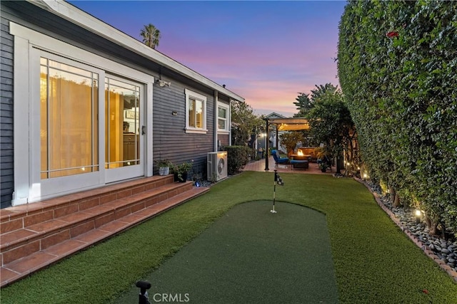 view of yard with ac unit and a patio area