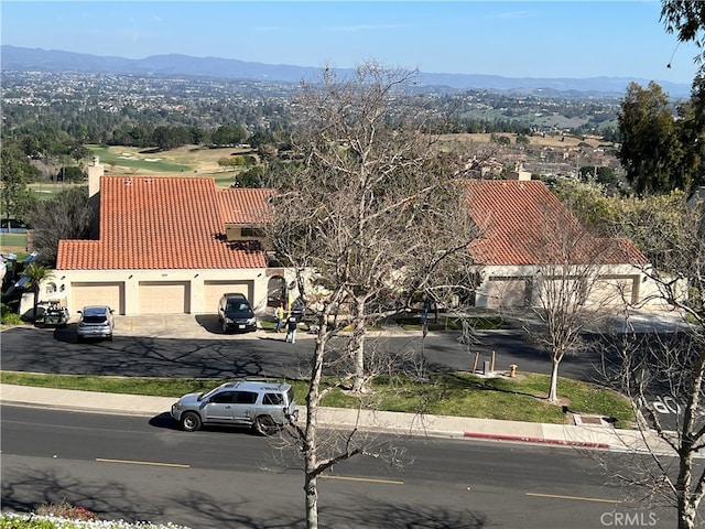 birds eye view of property with a mountain view