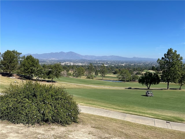 4018 Calle Sonora Este Unit C, Laguna Woods, CA 92637 - surrounding community with golf course view, a mountain view, and a lawn
