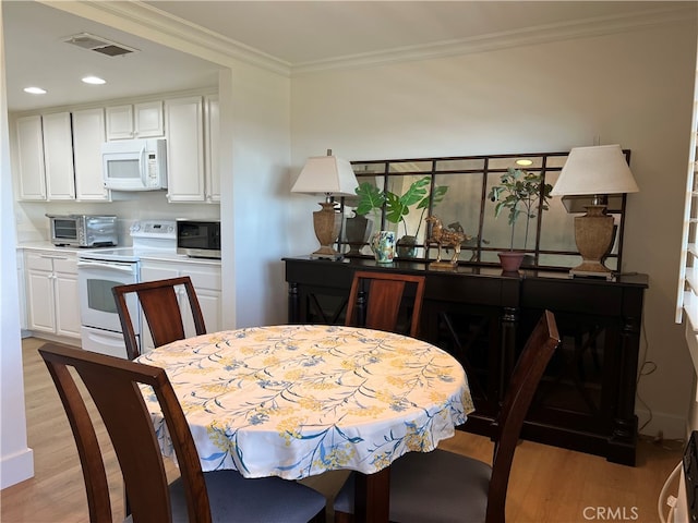 4018 Calle Sonora Este Unit C, Laguna Woods, CA 92637 - dining area with light wood-type flooring, ornamental molding, and recessed lighting