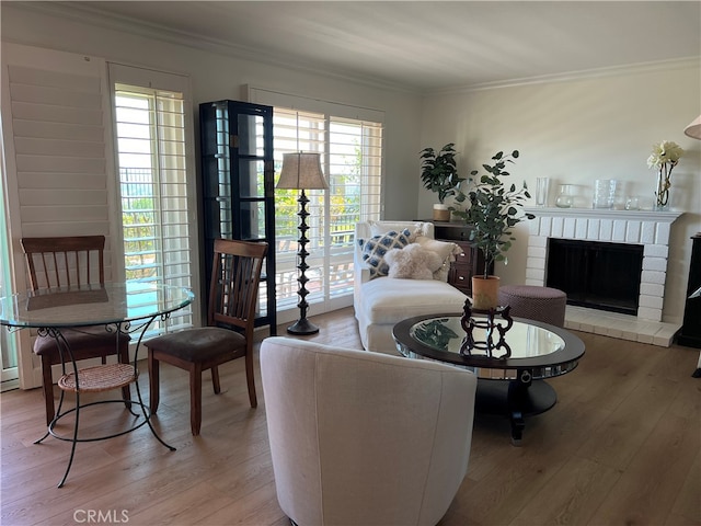 4018 Calle Sonora Este Unit C, Laguna Woods, CA 92637 - living area with ornamental molding, light wood finished floors, and a brick fireplace