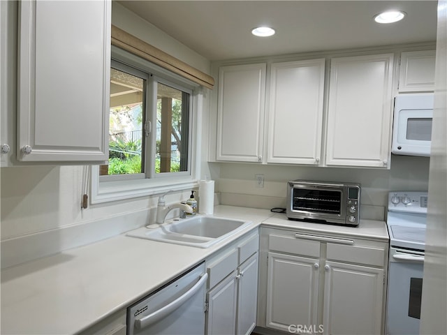 4018 Calle Sonora Este Unit C, Laguna Woods, CA 92637 - kitchen with white appliances, a sink, white cabinetry, light countertops, and recessed lighting