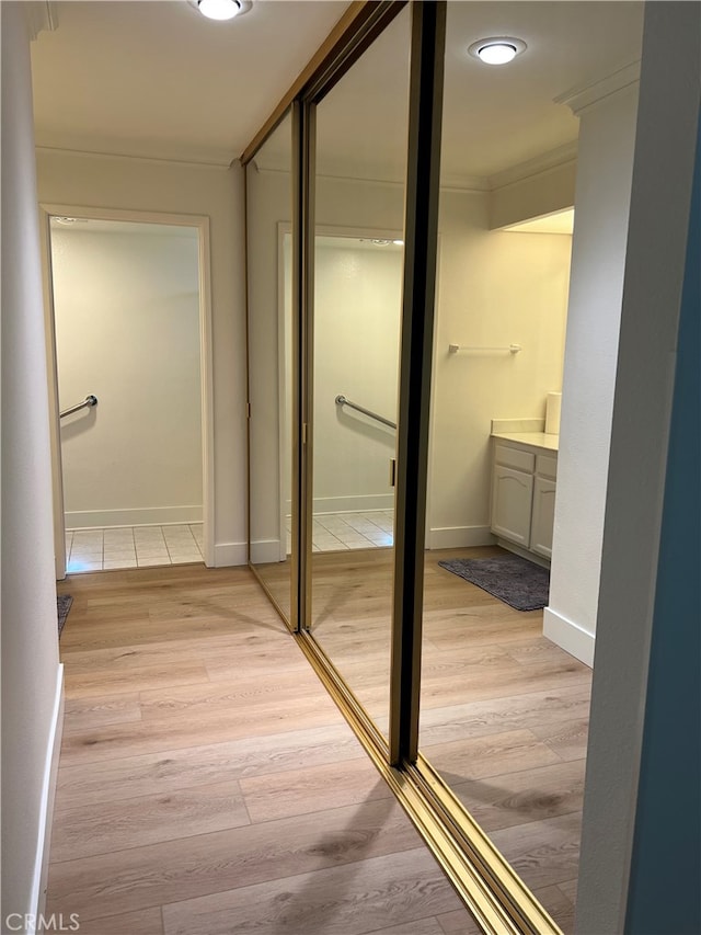 4018 Calle Sonora Este Unit C, Laguna Woods, CA 92637 - hallway with crown molding and light wood-style floors