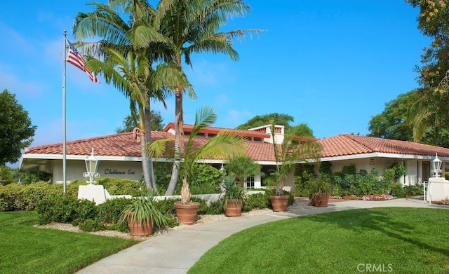 4018 Calle Sonora Este Unit C, Laguna Woods, CA 92637 - view of front of house with a tiled roof, a front yard, and stucco siding