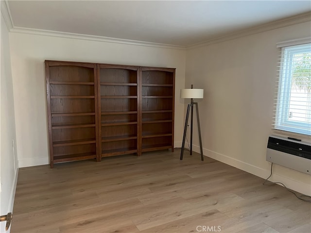 4018 Calle Sonora Este Unit C, Laguna Woods, CA 92637 - unfurnished room featuring light wood-style flooring, ornamental molding, baseboards, and a wall unit AC