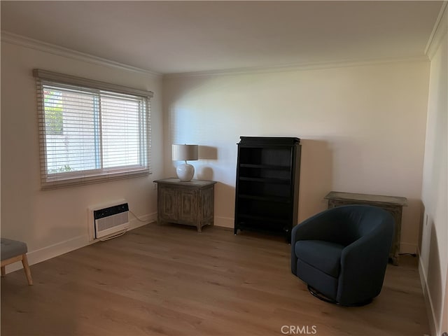 4018 Calle Sonora Este Unit C, Laguna Woods, CA 92637 - sitting room featuring crown molding, light wood-style floors, baseboards, and heating unit