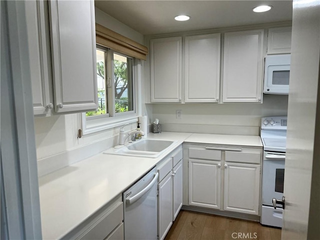 4018 Calle Sonora Este Unit C, Laguna Woods, CA 92637 - kitchen featuring white appliances, light countertops, recessed lighting, white cabinets, and dark wood-type flooring