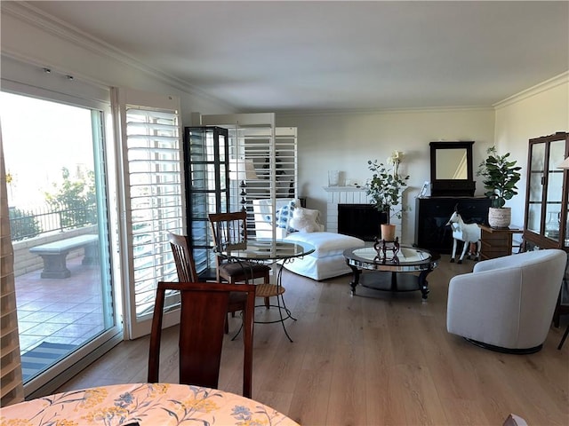 4018 Calle Sonora Este Unit C, Laguna Woods, CA 92637 - living area featuring wood finished floors, crown molding, and a brick fireplace