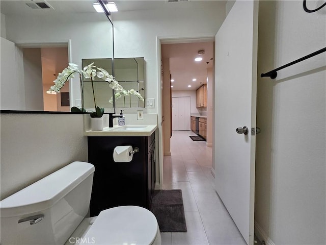 bathroom featuring toilet, recessed lighting, visible vents, and vanity