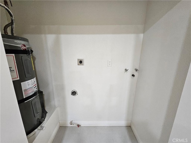 washroom featuring laundry area, baseboards, strapped water heater, hookup for a washing machine, and hookup for an electric dryer