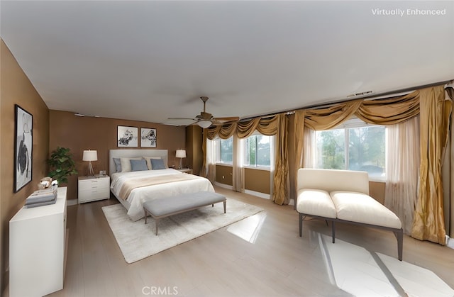 bedroom featuring ceiling fan and light wood finished floors