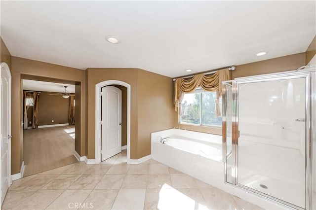 bathroom featuring a garden tub, recessed lighting, a stall shower, baseboards, and tile patterned floors