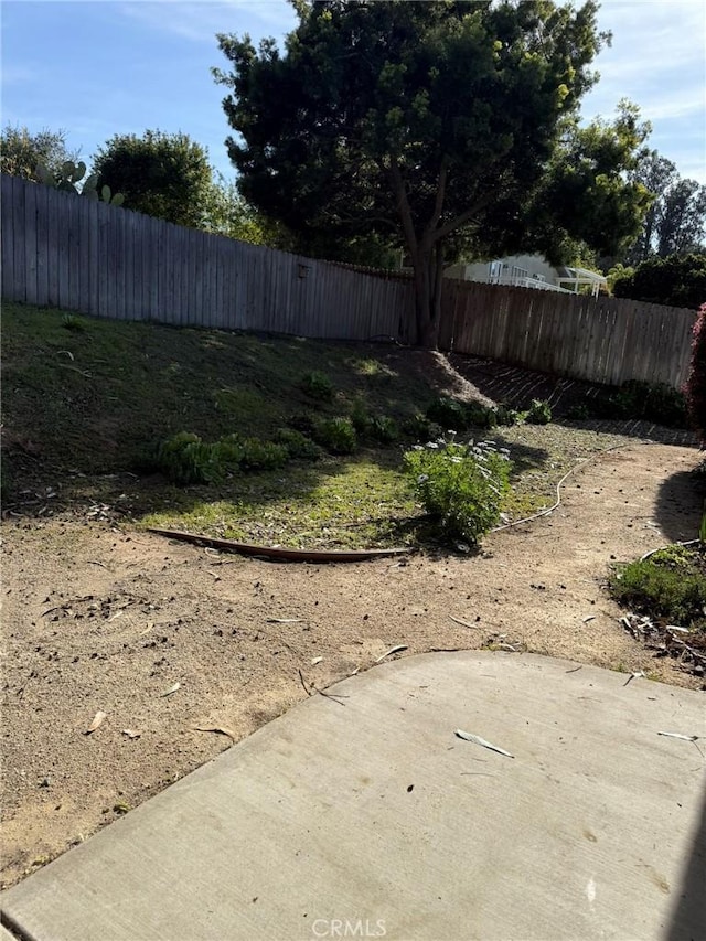 view of yard featuring a patio area and fence