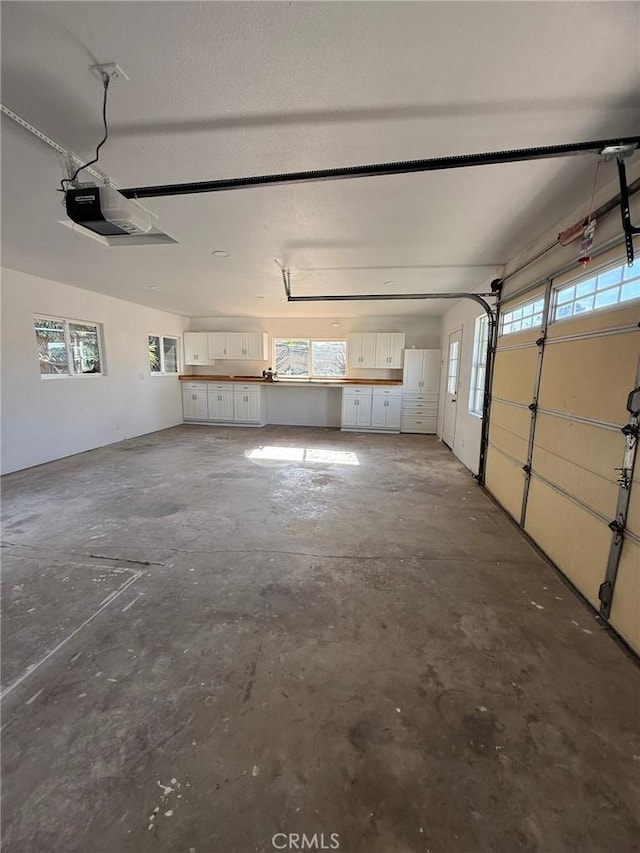 garage featuring a garage door opener