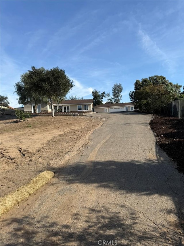 view of road featuring driveway