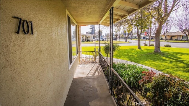 exterior space featuring a porch and a residential view