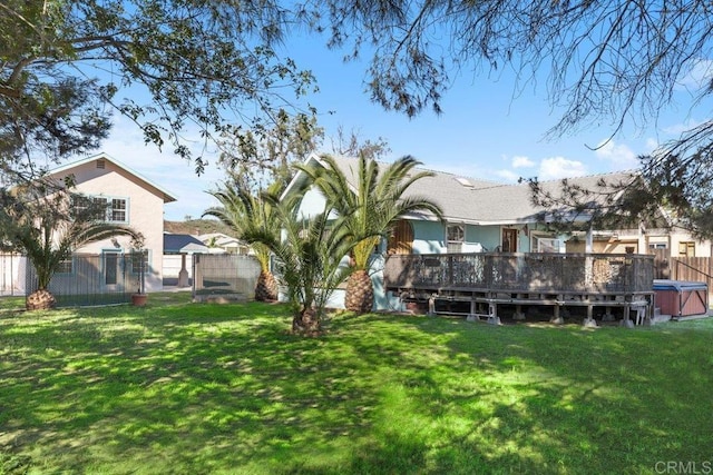 view of yard featuring a deck and fence