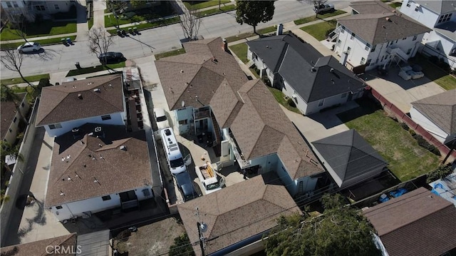 birds eye view of property with a residential view