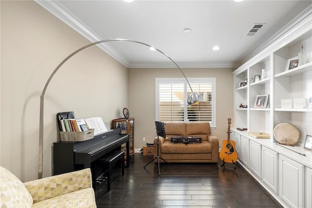 living area with ornamental molding, dark wood finished floors, visible vents, and recessed lighting