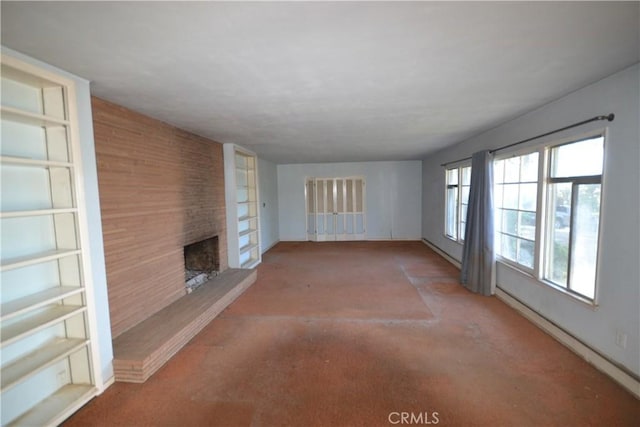 unfurnished living room with a large fireplace