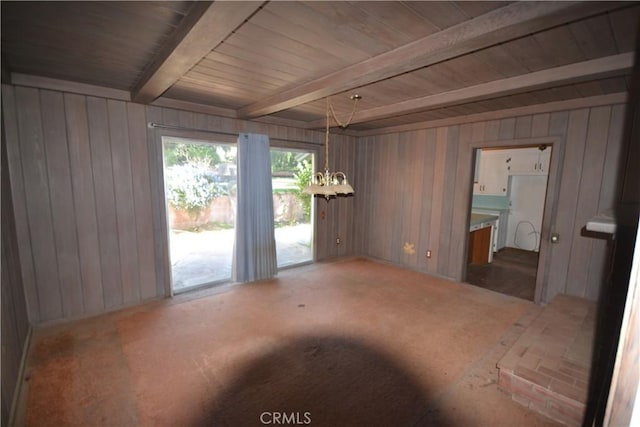 empty room featuring wooden ceiling, a notable chandelier, wooden walls, and beamed ceiling