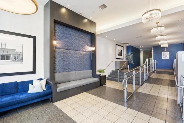 building lobby with visible vents and stairs