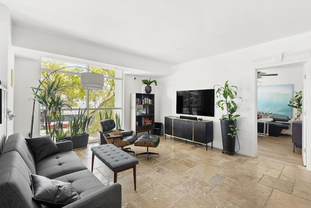 living room with stone tile floors